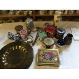 A mixture of items including tins and a brass plate.