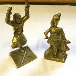 Two brass figures One a band leader the other a sword dancer.