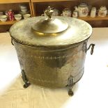 A brass coal scuttle with liner.