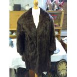 A ladies fur coat.