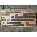 An 8 ft by 4 ft board with various metal flags and related plaque descriptions.