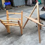 A wooden easel and a wall bracket.