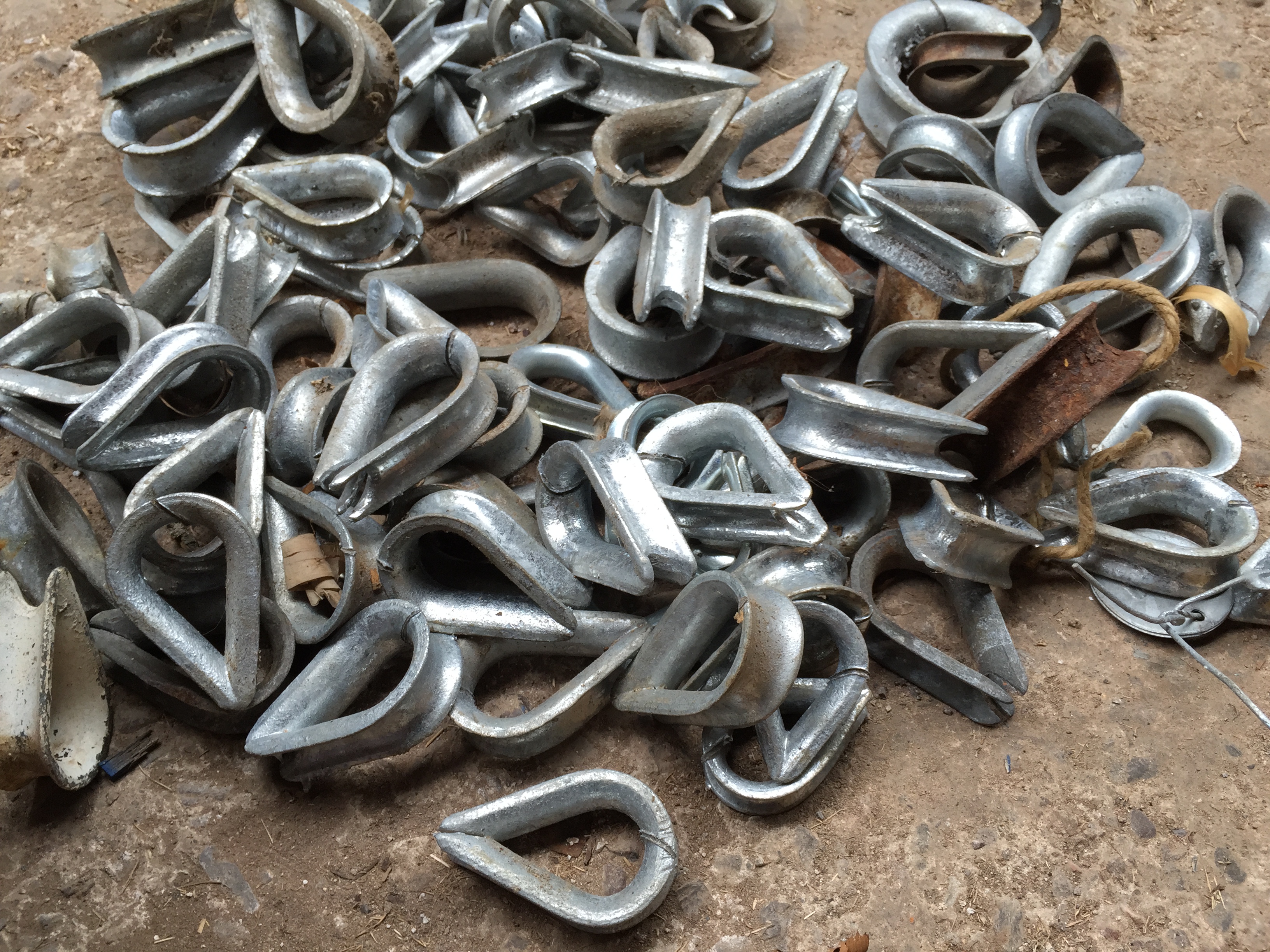 A bucket of rope thimbles.