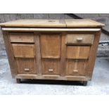 A large box with mock drawers. Would be suitable for conversion to a kitchen unit or a shop counter.