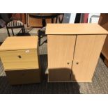 A two drawer filing cabinet and a small