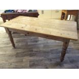 A large pine kitchen table.