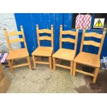Four kitchen chairs.