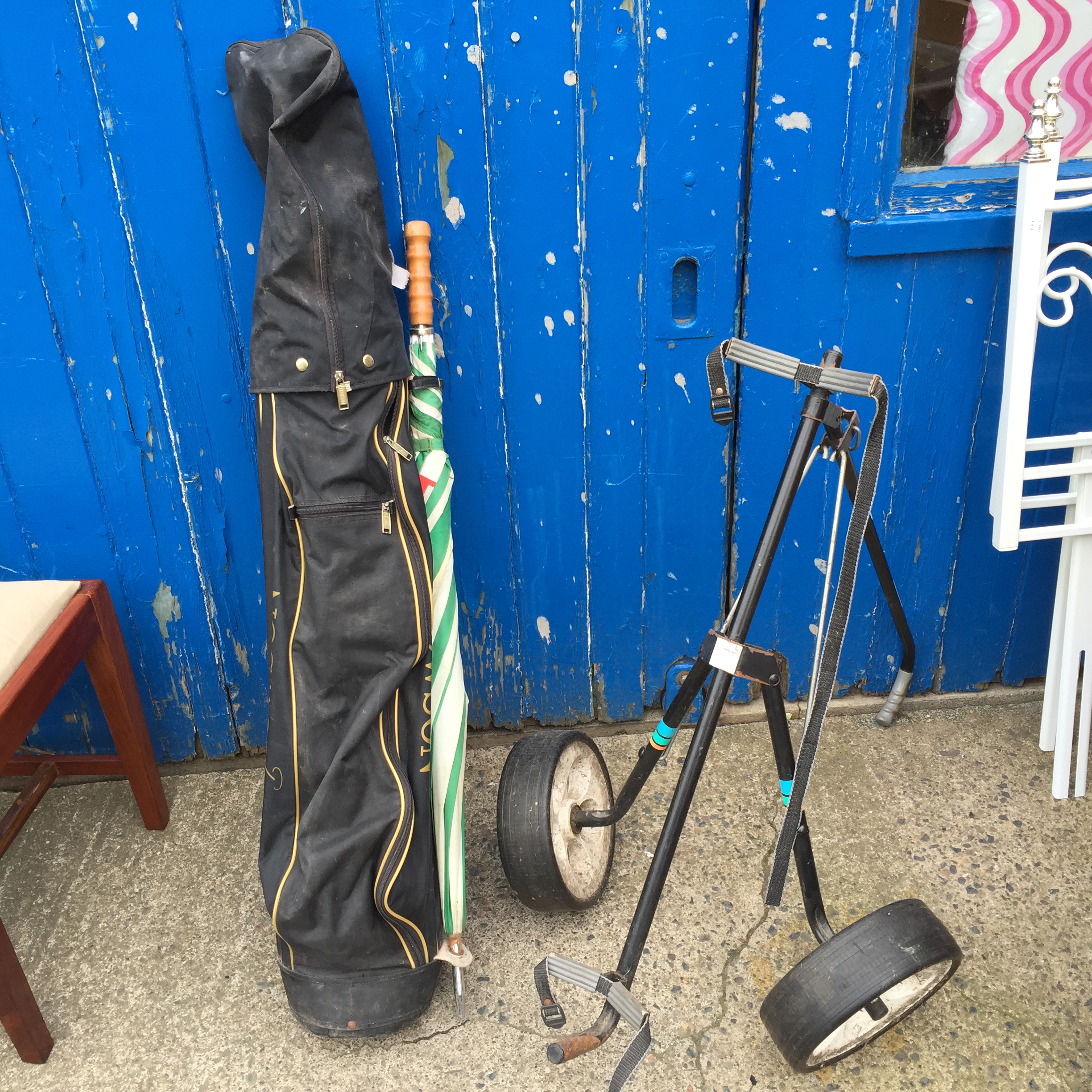 A set of left handed golf clubs, a Howso