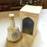 A Bells whiskey decanter.