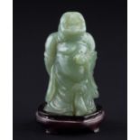 Jade Buddha China 20. Jhd./Jade Buddha China 20th Century  auf Holzsockel stehend, H: ca. 10,5