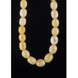 Bernstein Kette/ Amber Necklace, antique Art Deco  butterscotch - weiß, Gewicht 85 g., L: 80 cm,