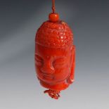 Reserve: 390 EUR        Buddha-Kopf aus Koralle. China. Kleiner geschnittener Kopf mit Lockenfrisur.