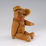 Gelber Seidenplüsch-Teddy. Holzwollegestopfter Bär mit Stimme, drehbarem Kopf, braunen Glasaugen,