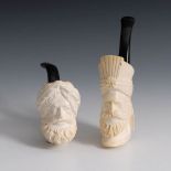 2 Meerschaumpfeifen "Araber-Köpfe". Wohl 20. Jh. Geschnitzte Köpfe bärtiger Orientalen mit Turban