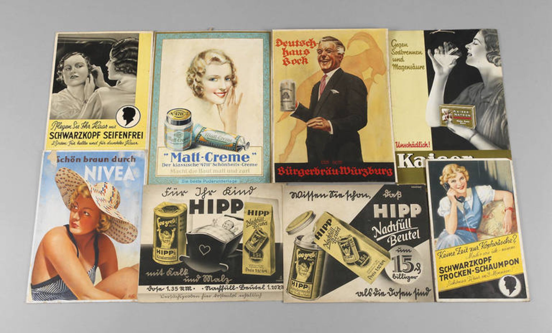 Acht Werbeaufsteller
aus Drogeriebestand 1930/1950er Jahre, dabei Schwarzkopf, Nivea, Hipp,