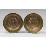 PAIR OF BRASS ALMONER PLATES, 19TH CENTURY embossed cavetto with the Holy Virgin figure with a