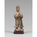 SCULPTURE IN PAINTED WOOD IN POLYCHROMY, CHINA XVII CENTURY depicting a Taoist deity that holds a