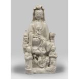 GROUP IN WHITE PORCELAIN, CHINA END OF THE 17TH, EARLY 18TH CENTURY depicting Guanyin portrayed on a