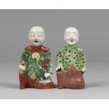 PAIR OF SCULPTURES IN POLYCHROME GLAZE PORCELAIN , CHINA XIX CENTURY depicting two children in
