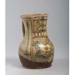 PITCHER IN MAJOLICA, CERRETO, EARLY 19TH CENTURY enamel cream, with decorations in flowers and