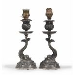 PAIR OF SILVER CANDLESTICKS, 20TH CENTURY with dolphins and leaves. Rounded feet. Height 17 cm,