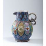 CERAMIC PITCHER, ITALY 50s in polychrome enamels, with decorations in shamrocks and geometries.