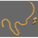 PARURE OF NECKLACE AND PAIR OF EARRINGS
yellow gold 18 kt. with filigree.
Length cm. 41, weight