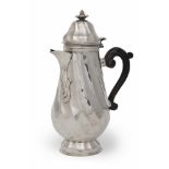 FINE TEAPOT IN SILVER, PROBABLY ENGLAND 18TH CENTURY

torceon, embossed and engraved crest. Handle