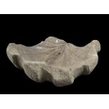 FRAGMENT OF STONE BASIN, 17TH CENTURY

sculpted internally like shell. Scalloped border. 

Size