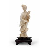 SCULPTURE IN IVORY, CHINA, EARLY 20TH CENTURY depicting He Xiangu portrayed in classical