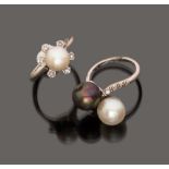 TWO RINGS in white gold 18 kt., three natural cultivated pearls, of which one grey, and small