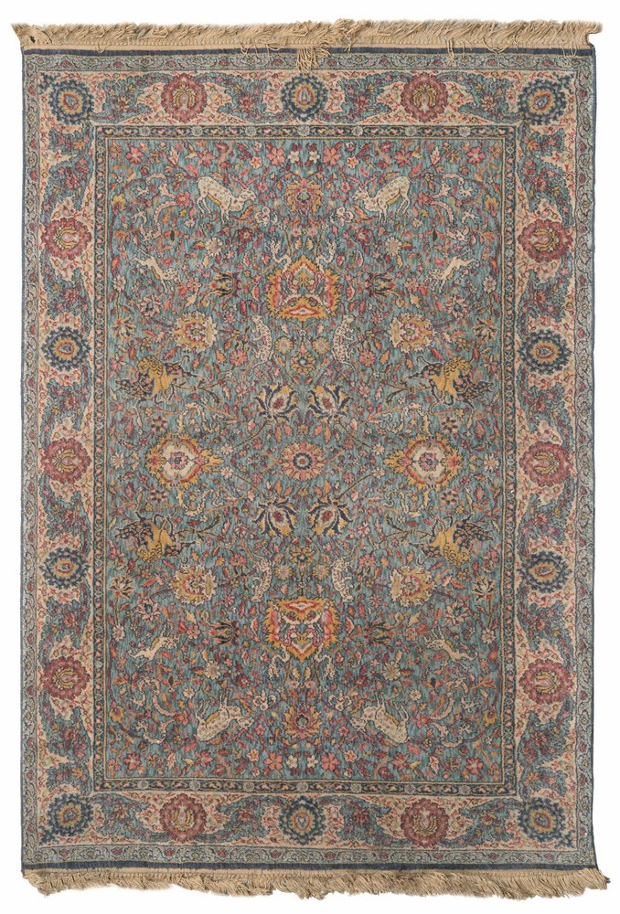 MECHANICAL LOOM RUG, 20TH CENTURY Tabriz design, with blossom and animals, in centre field with blue
