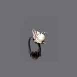 FINE RING in white gold 18 kt., central pearl and black diamond and diamond surround. Pearl mm. 8,2,