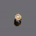 FINE RING in yellow gold 18 kt., with central diamond and wit wit cut diamond surround. Central