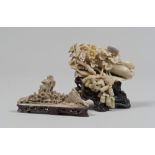 TWO SCULPTURES IN SOAPSTONE, ENGRAVED AND PIERCED, CHINA FIRST HALF 20TH CENTURY depicting a