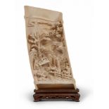 PLAQUE IN CARVED AND ENGRAVED IVORY, CHINA, EARLY 20TH CENTURY depicting a traditional garden with