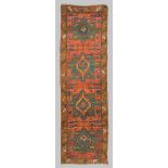 KAZAK RUNNER RUG, LATE 19TH CENTURY medallions on green base and secondary motifs with leaves,