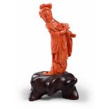 SCULPTURE IN RED CORAL, CHINA, EARLY 20TH CENTURY depicting He Xiangu portrayed in classical