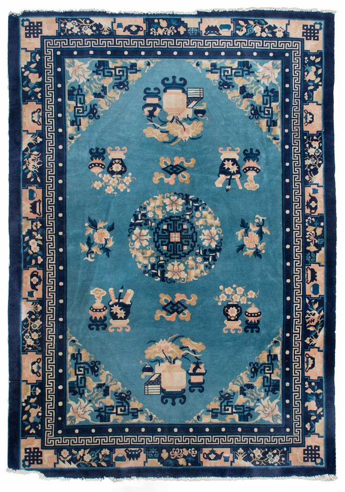 CHINESE RUG, BEIJING MID 20TH CENTURY medallion design with leaves, vases, objects and flowers, in