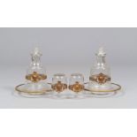 PAIR OF LIQUOR BOTTLES IN GLASS, EARLY 20TH CENTURY

with glasses and plate. Finishes in gilt metal.