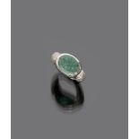 RING

white gold 18 kt., central emerald engraved with flower and diamond surround.

Emerald ct. 2.