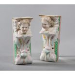 PAIR OF SHELVES IN PORCELAIN, PROBABLY GERMANY 19TH CENTURY

polychrome, shaped as child's head.