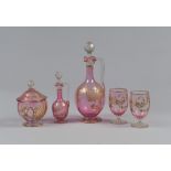LIQUOR SET IN GLASS, EARLY 20TH CENTURY

pink base, with gold decorations. Bottle, small bottle,