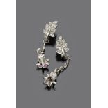 FINE PAIR OF EARRINGS

white gold 18 kt. leaves decorated with diamonds and pendants in bell shape