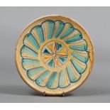 PLATE IN MAJOLICA, CENTRAL ITALY 20TH CENTURY

archaic geometric pattern in green, yellow and