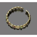 FINE RIGID CHOKER

yellow gold 18 kt. with heart shaped elements decorated with rubies, emeralds and