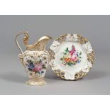 JUG AND PLATE IN PORCELAIN, 19TH CENTURY

white and polychrome glazing, with floral motif. 

Size of