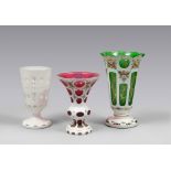 THREE GLASS VASES, PROBABLY BOHEMIA 20TH CENTURY

white, purple and green. Two vases painted with