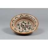 BASIN IN TERRACOTTA, ARCHAIC STYLE, EARLY 20TH CENTURY

ochre, geern and brown glazing, with