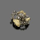 BROOCH

yellow gold and silver, blossom shape with rose cut diamonds. 

Size cm. 5 x 5, diamonds ct.
